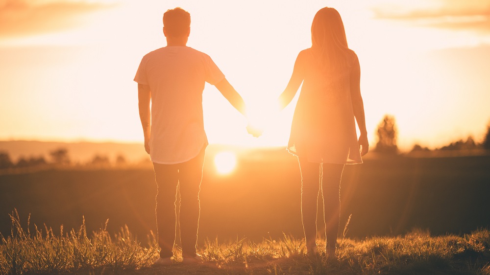 Hold hands in sunset